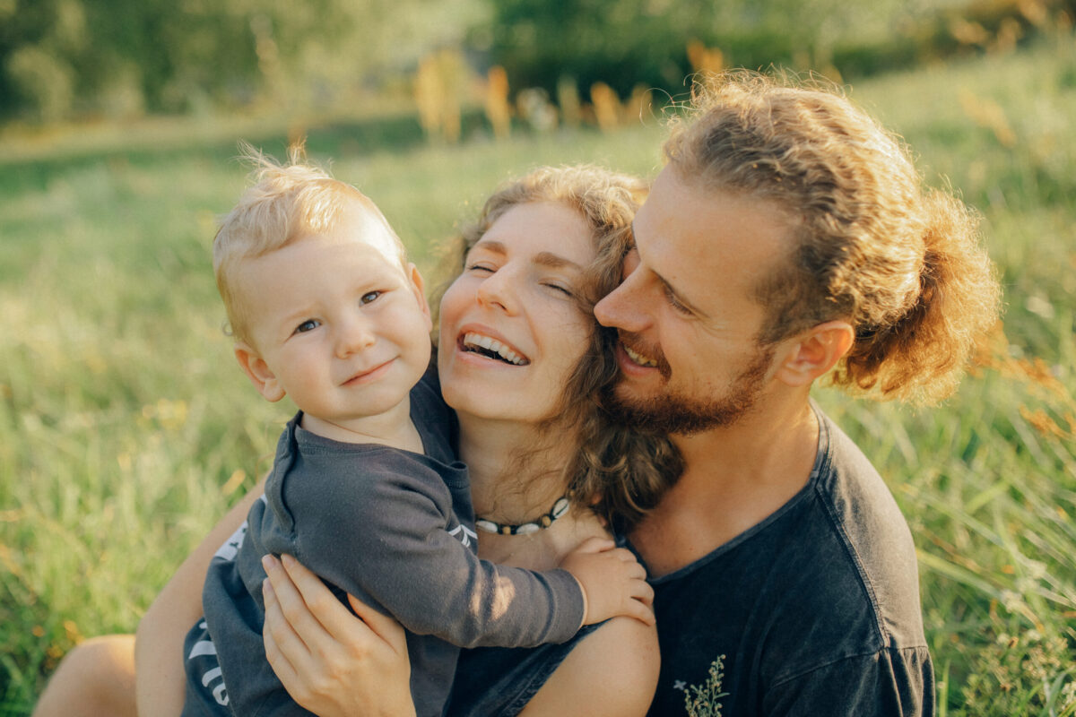 Blond baby with his parents
